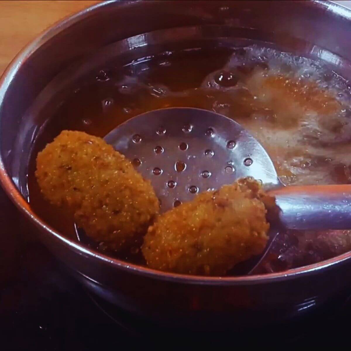 crispy fried potato nuggets in the pan.