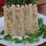 chicken mayo sandwich stacked on a plate.