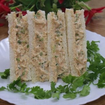 chicken mayo sandwich stacked on a plate.