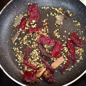 roasting the spices to make xacuti masala.