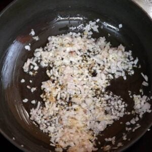 sauteing onions to make the goan chicken curry.