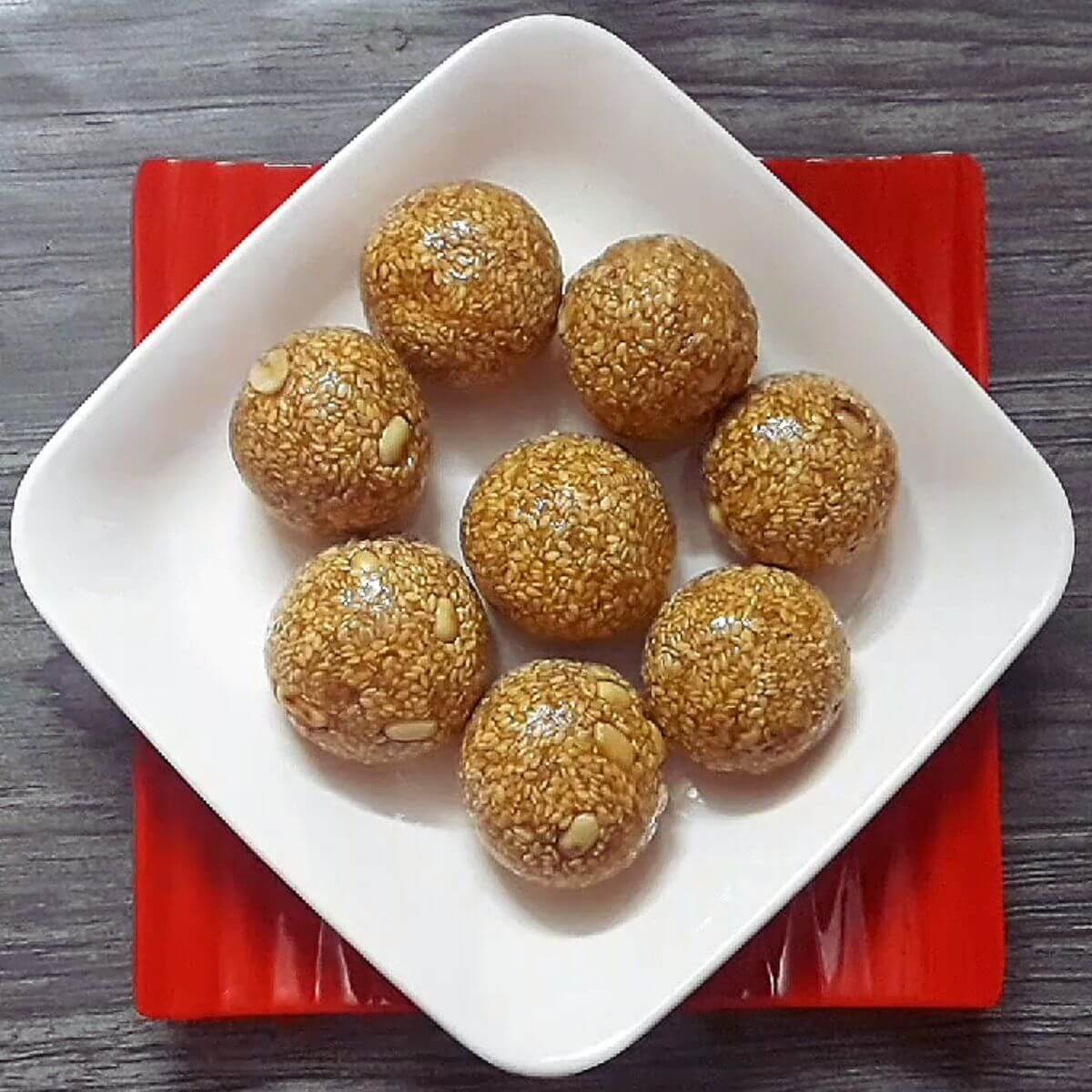 sesame seeds or til ladoo served in a plate.