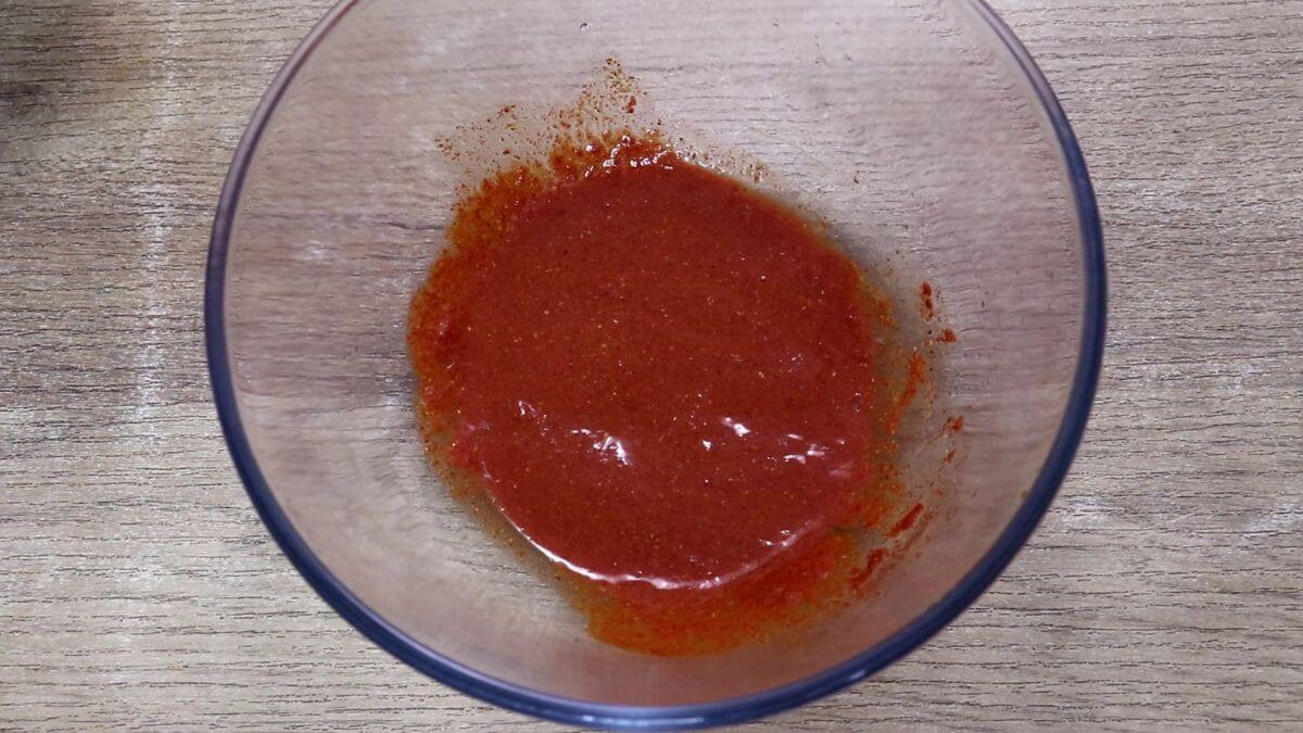 silver fish fry marinade in a glass bowl.
