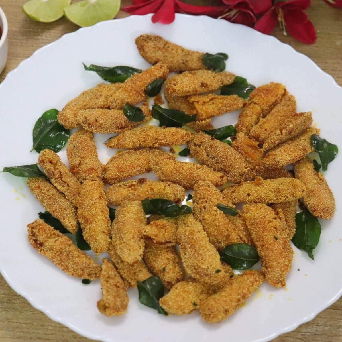 silver fish fry served in a white color plate. Mangalorean-style bolenjir fry.
