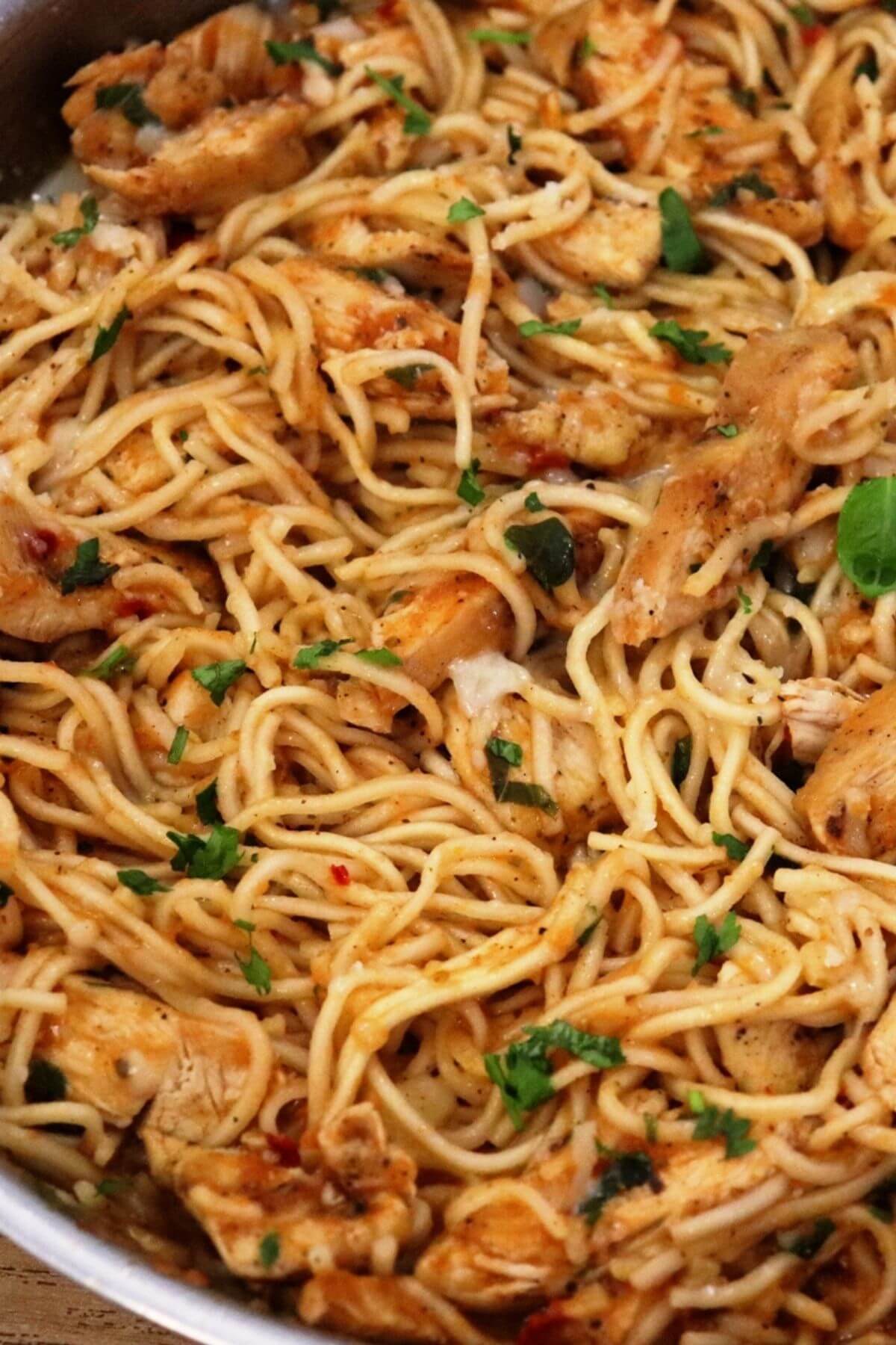 spicy chicken spaghetti in a pan.