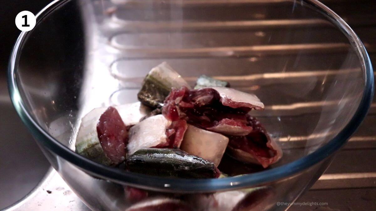 marinating the fish with salt for bangdyachi uddamethi.