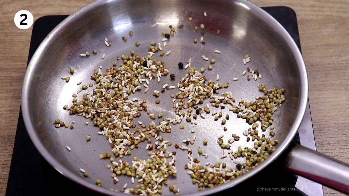 Roasting urad dal, methi, raw rice and spices for Uddamethi masala.