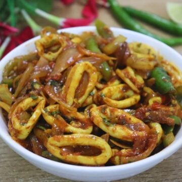 Squid chilli fry served in a white bowl.