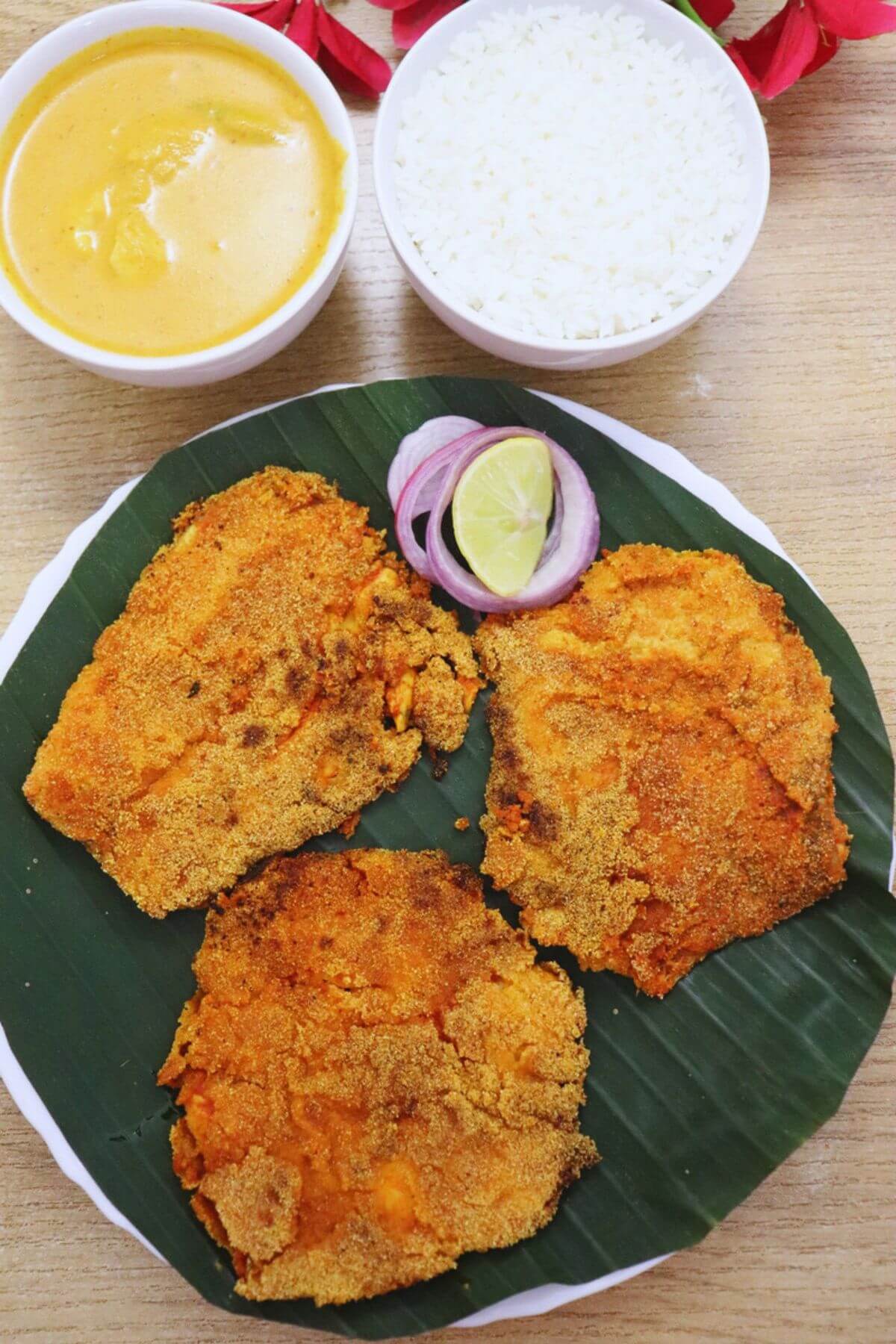 Goan style chonak rava fish fry served with rice and curry.