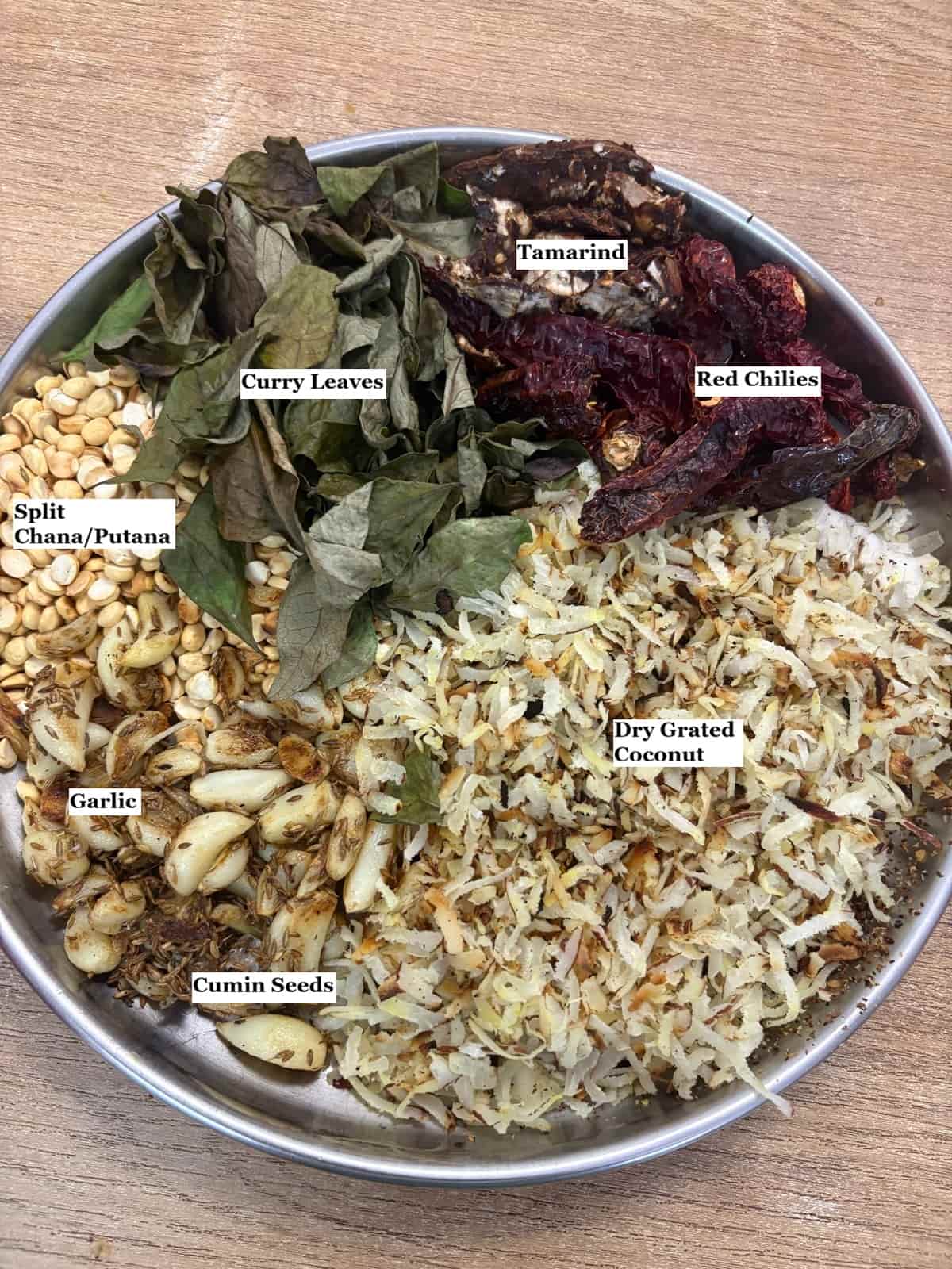 individually labelled ingredients to make chutney powder are laid out on a table.