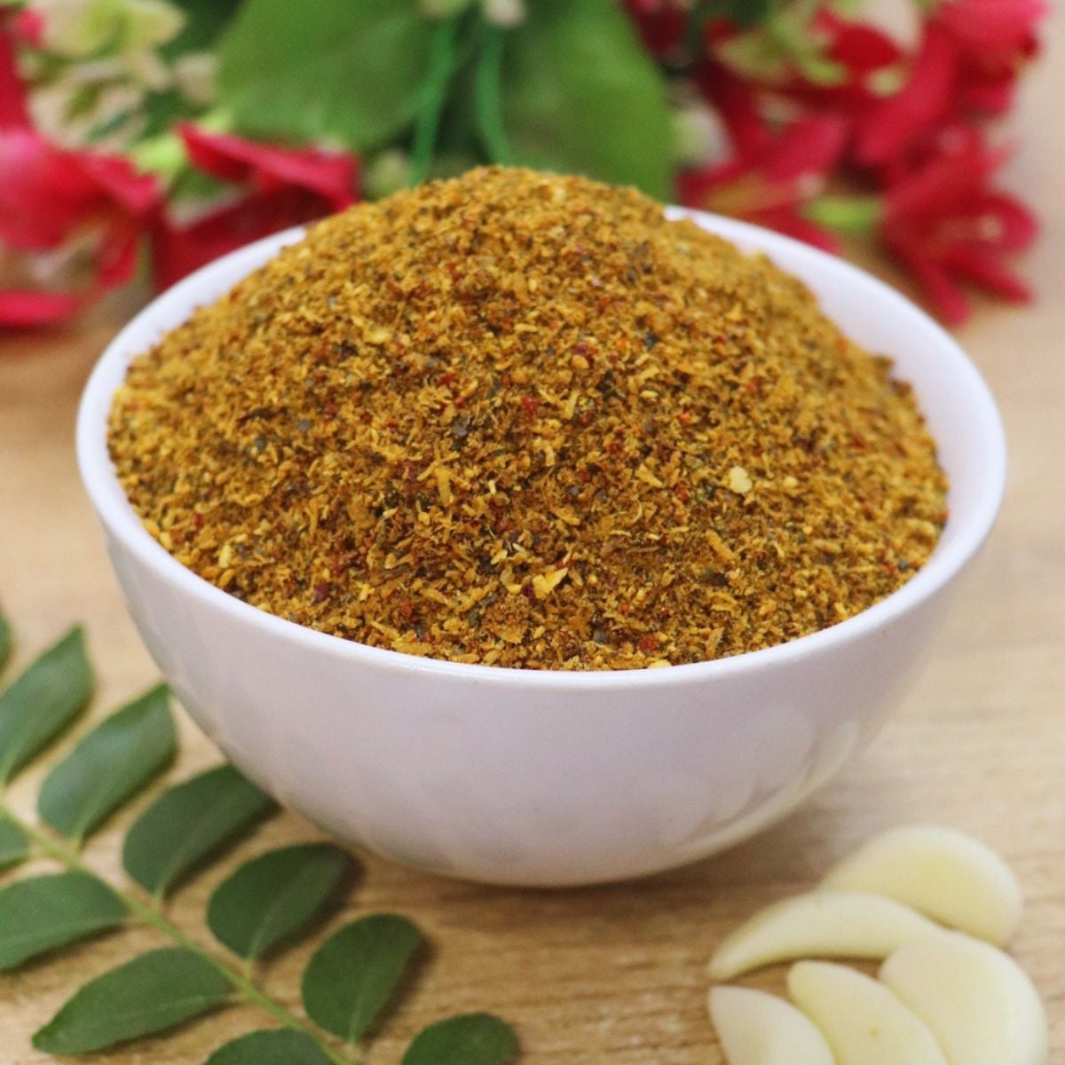 chutney powder karnataka style in a white bowl.