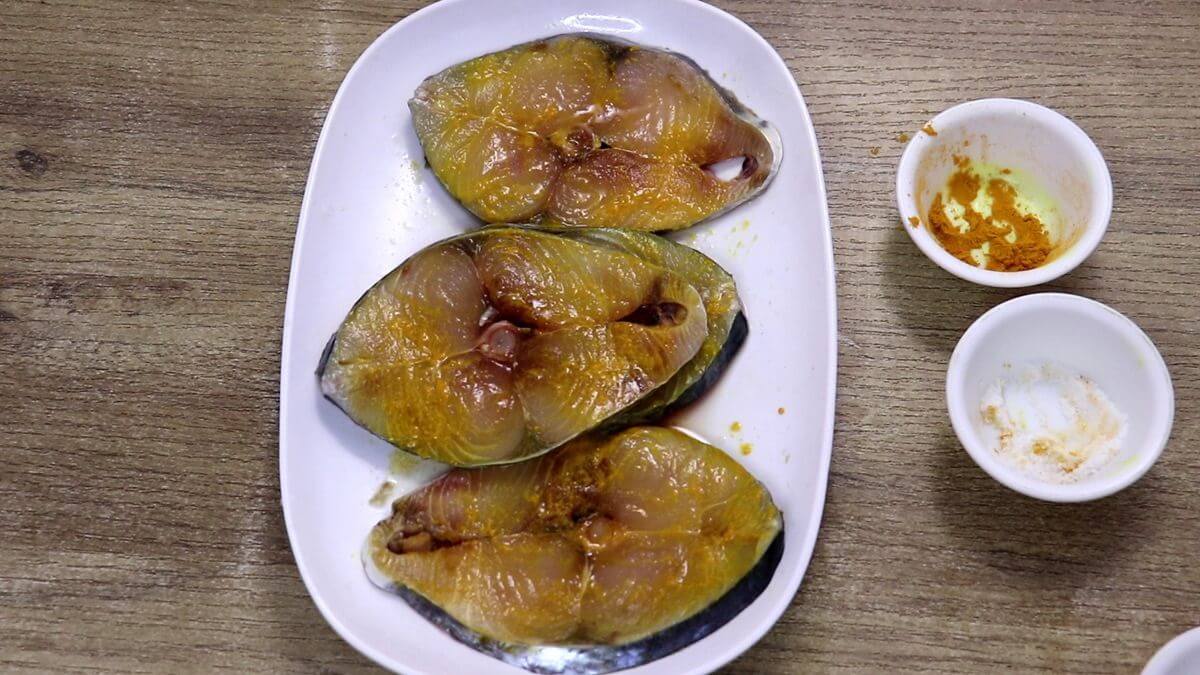 marinate fish with salt, turmeric and lemon juice for fish masala fry recipe.