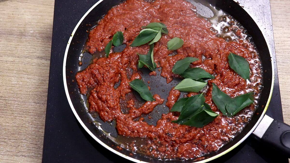 addition of curry leaves to fish fry masala.