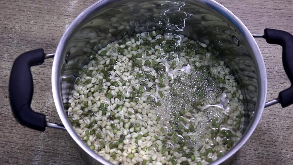 cooking moong in a pan.