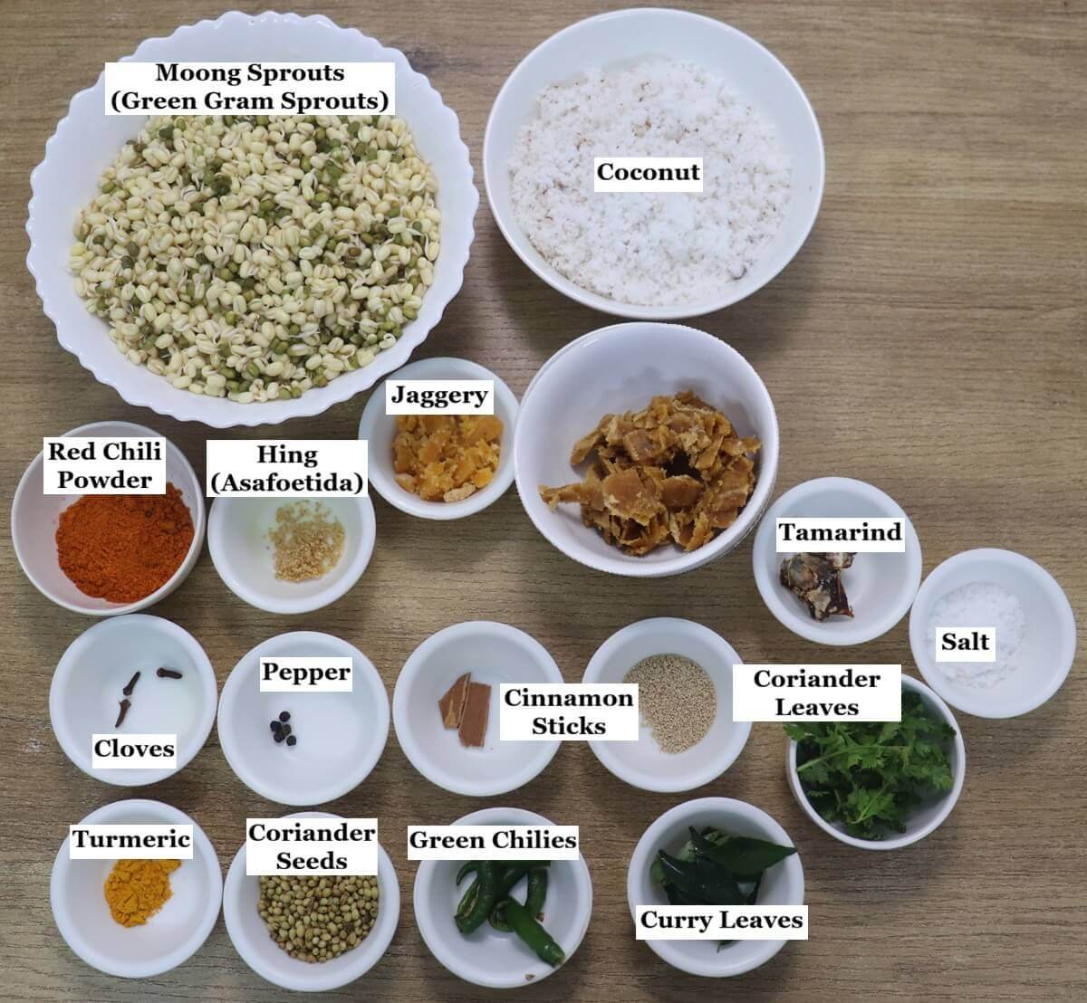 individually labelled ingredients to make Goan mooga gathi are laid out on a table.