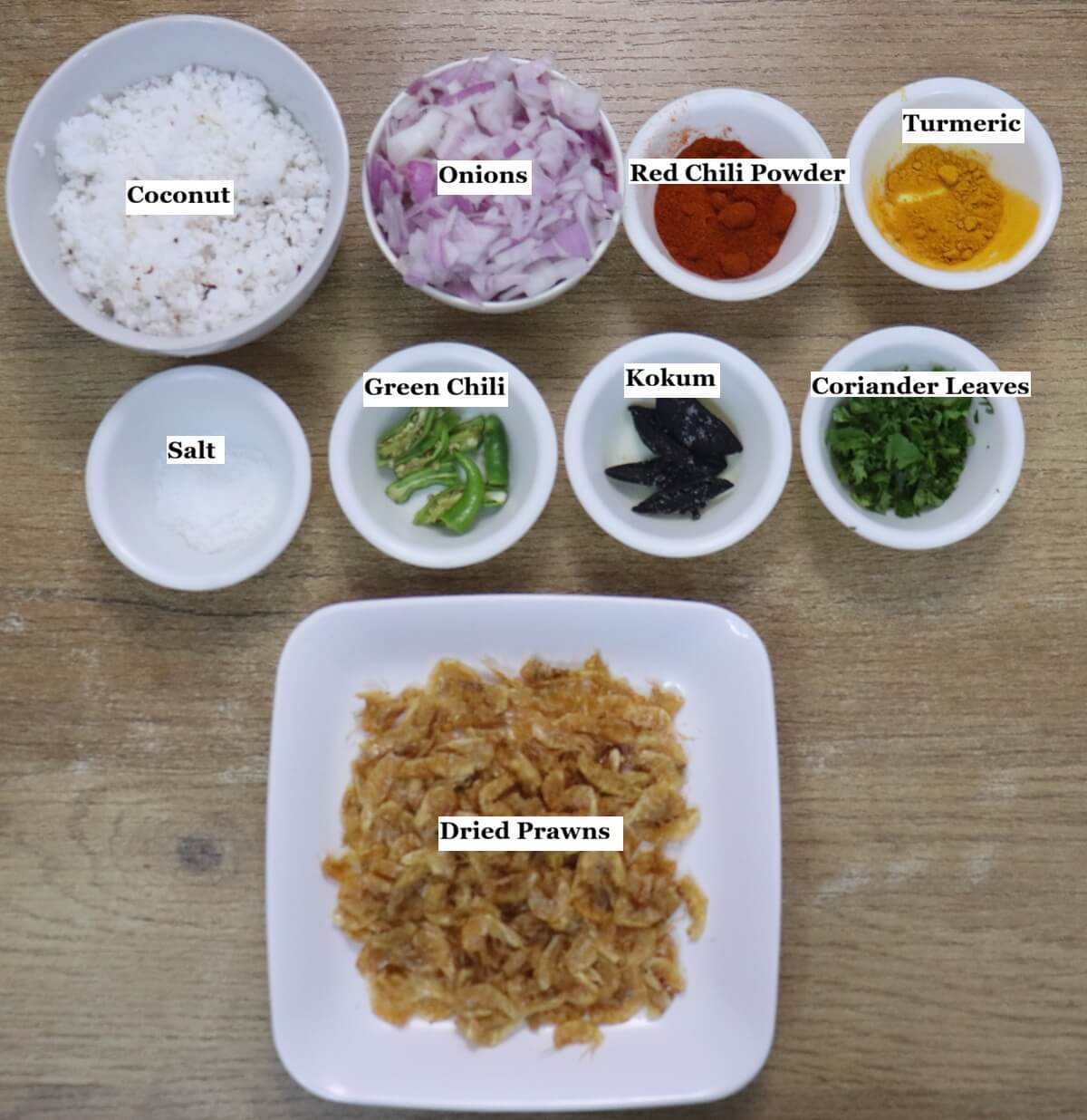 individually labelled ingredients to make prawns kismoor are laid out on a table.