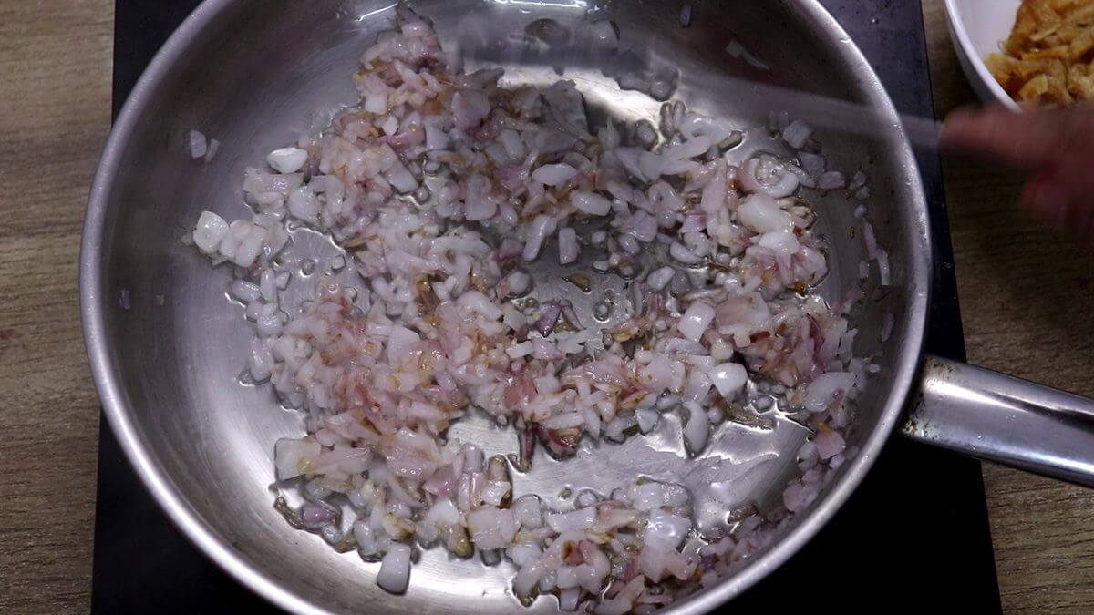 Sauté onions to make prawns kismoor.