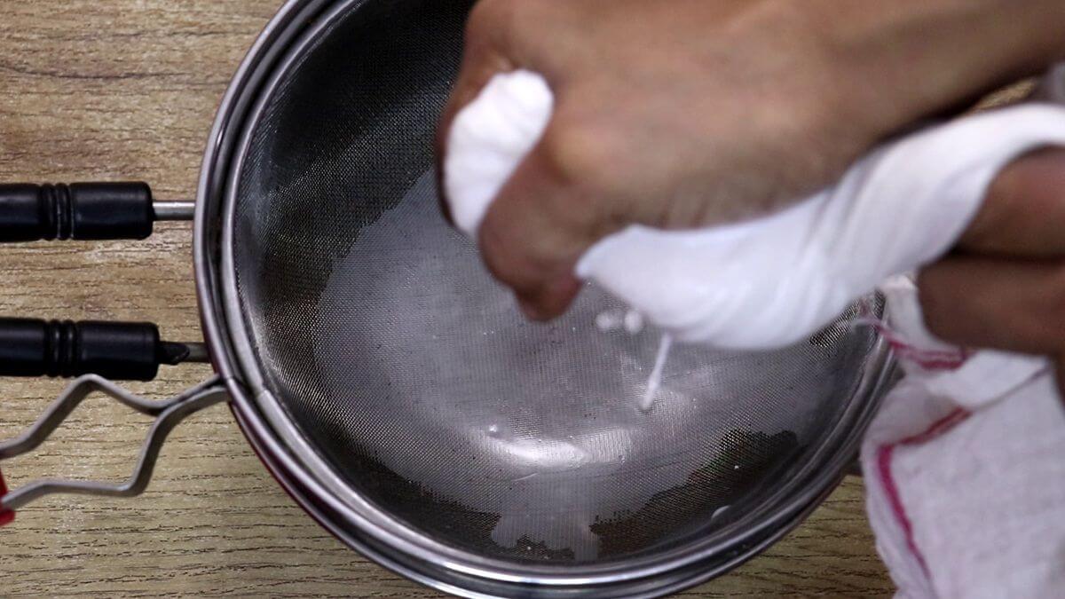 extracting coconut milk for making solkadhi recipe.
