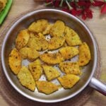 Crispy rava-coated breadfruit fry (neerpanas fry) slices in a pan.