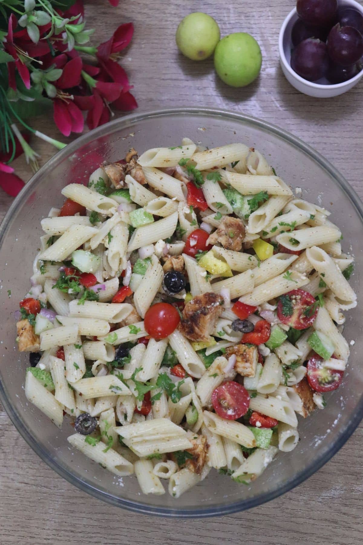 lemon chicken pasta salad with feta in a glass bowl.