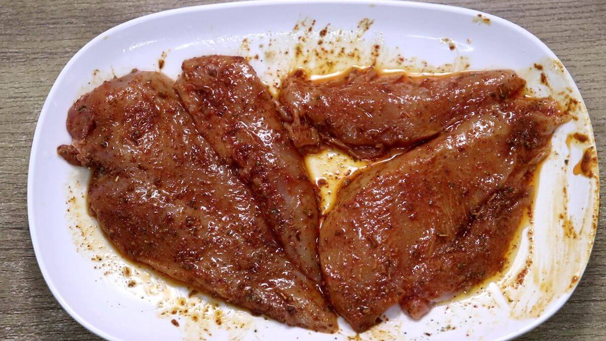 marinating chicken for prepping pasta salad recipe.