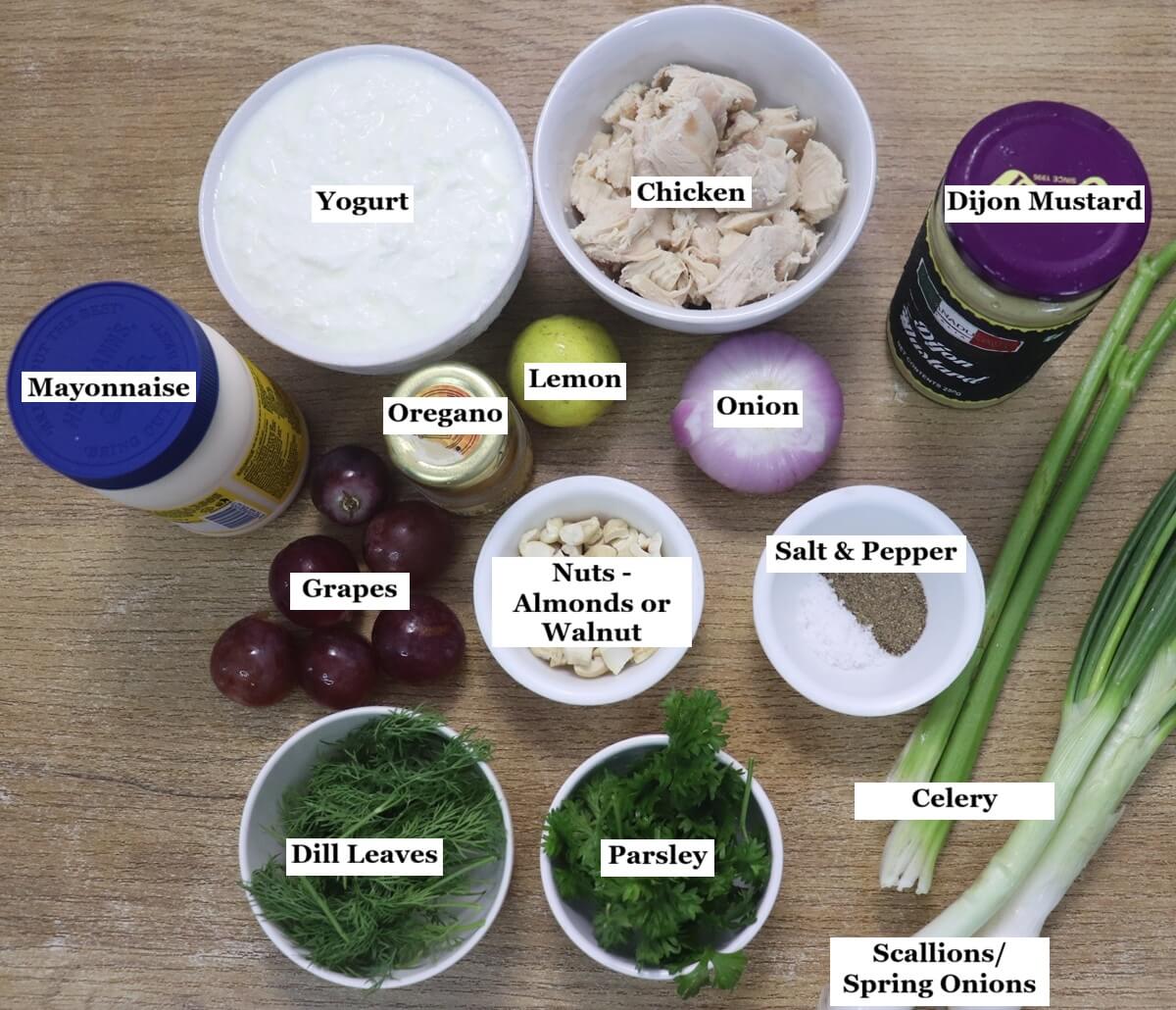 individually labelled ingredients to make chicken mayo salad are laid out on a table.