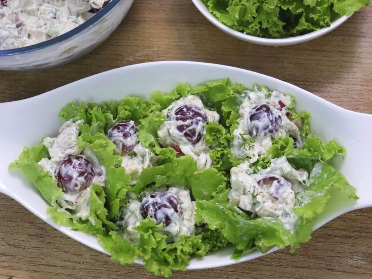 chicken mayo salad served on lettuce leaves in a big bowl.
