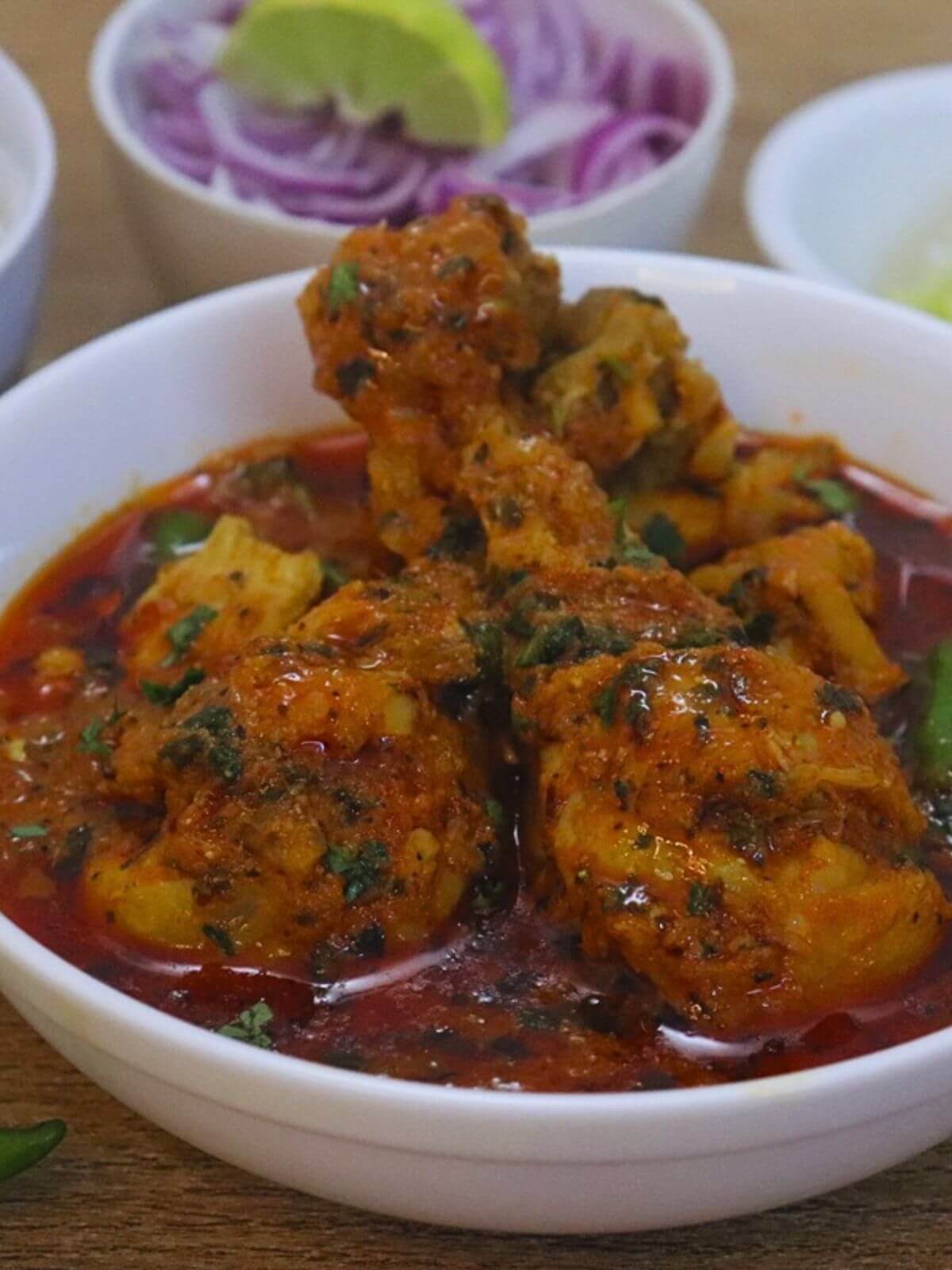 dhaba style chicken curry served in a bowl.