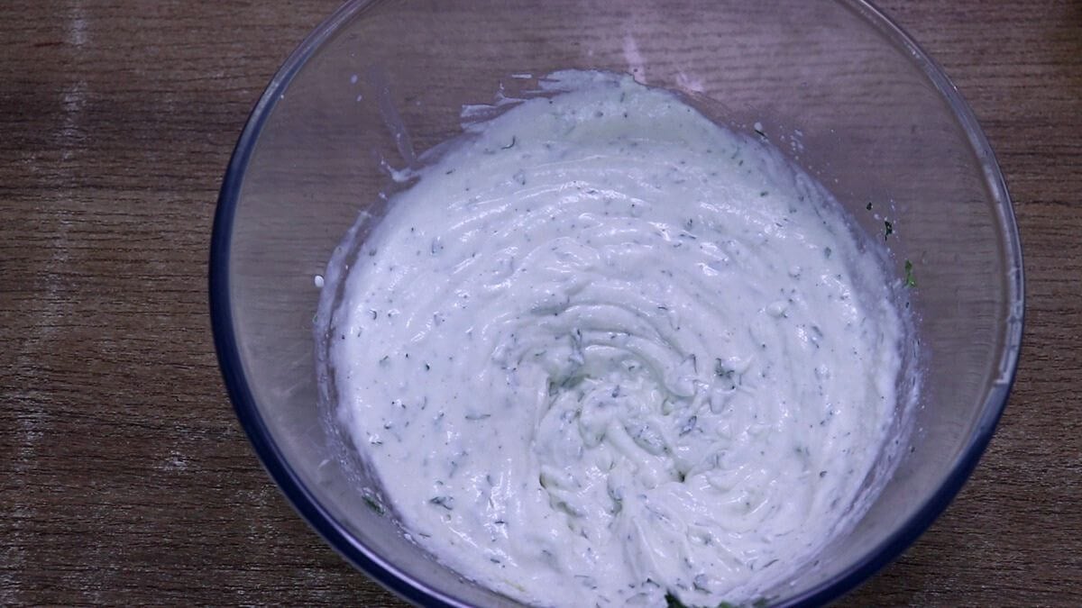 Creamy Greek yogurt dressing prepared for Mediterranean chicken salad.