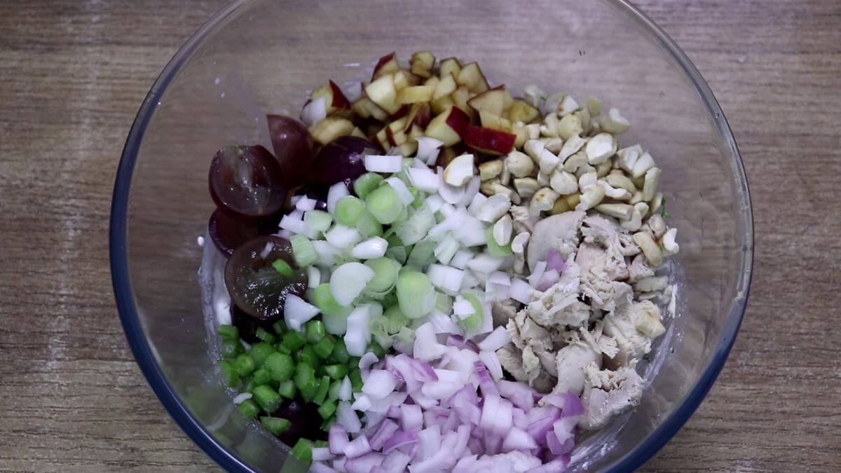 Chicken, apples, grapes, celery, onion, herbs, and nuts added to Greek yogurt dressing.
