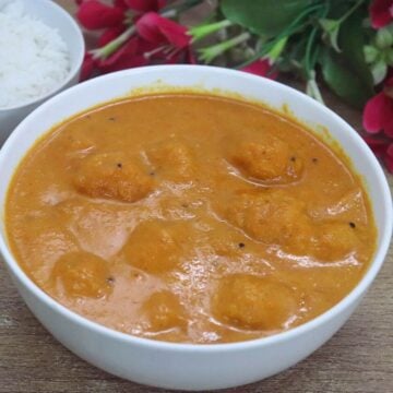 Goan mango sasav served in a white bowl.