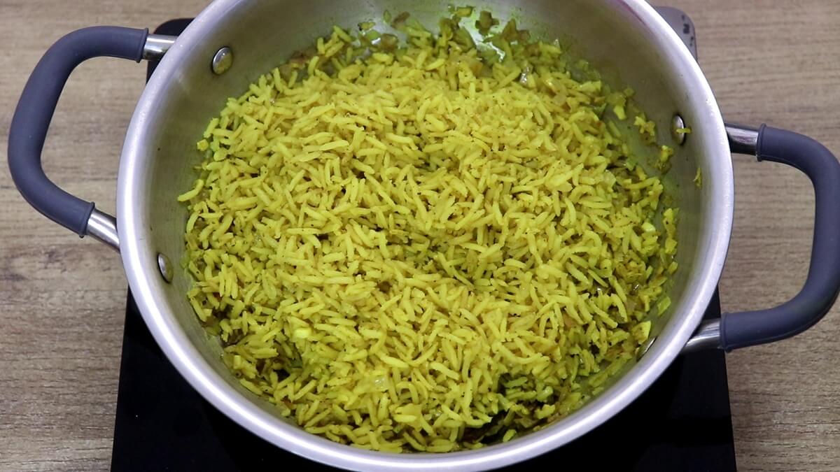 fluffy turmeric rice in a pot.