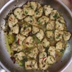 lemon garlic chicken made with juicy chicken breast, garlic, lemon, and herbs in a skillet.