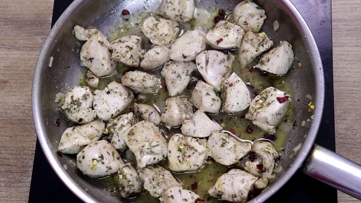 chicken breast pieces pan-seared until golden for lemon garlic chicken.