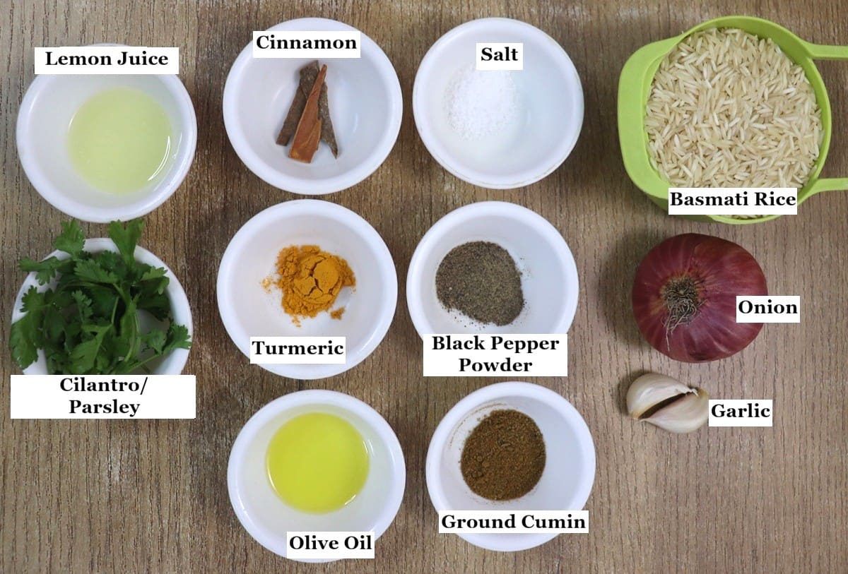 individually labelled ingredients to make mediterranean yellow rice are laid out on a table.