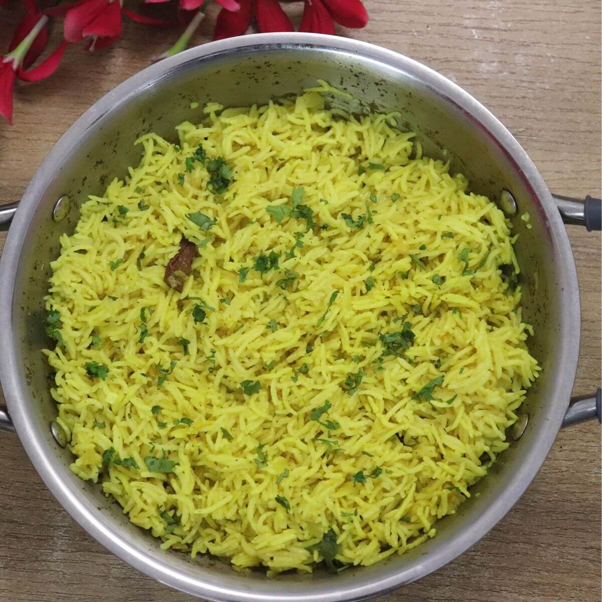Mediterranean yellow rice in a pot. Garnished with cilantro.