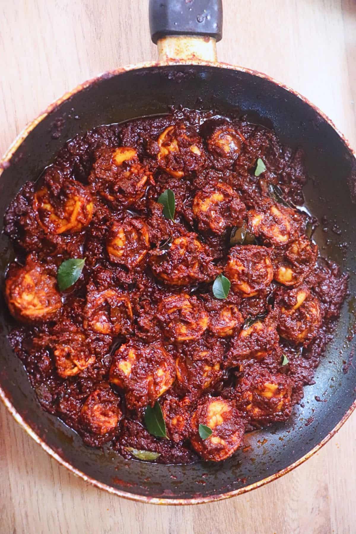 Prawn ghee roast cooked in a pan.