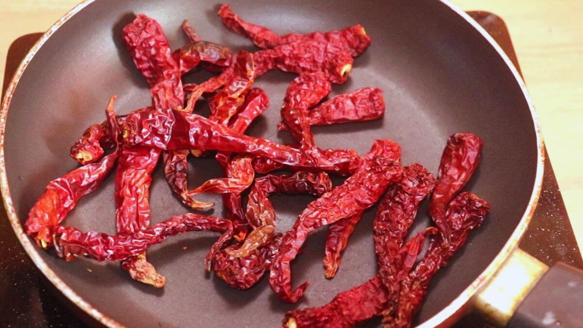 Byadagi red chilies dry roasting until crisp for ghee roast masala.