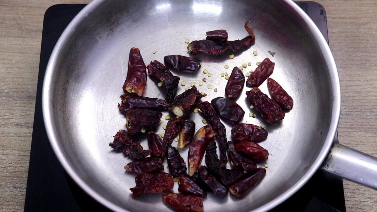 Roasting dried red chillies for homemade Xacuti masala powder.