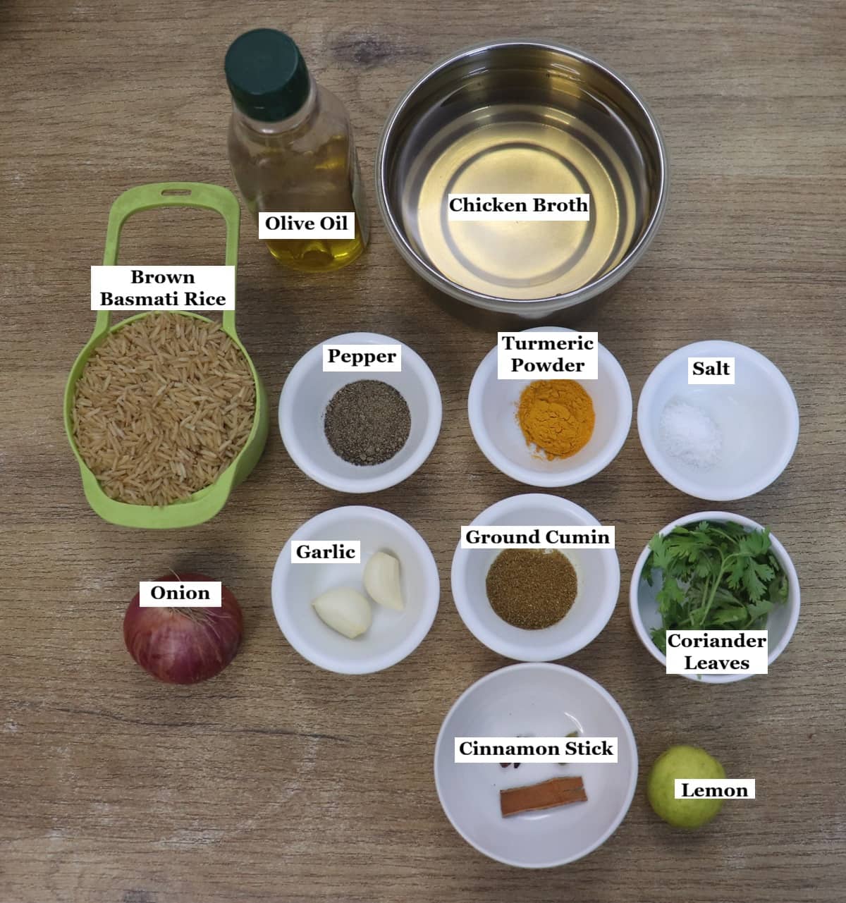 individually labelled ingredients to make turmeric rice laid out on a table.