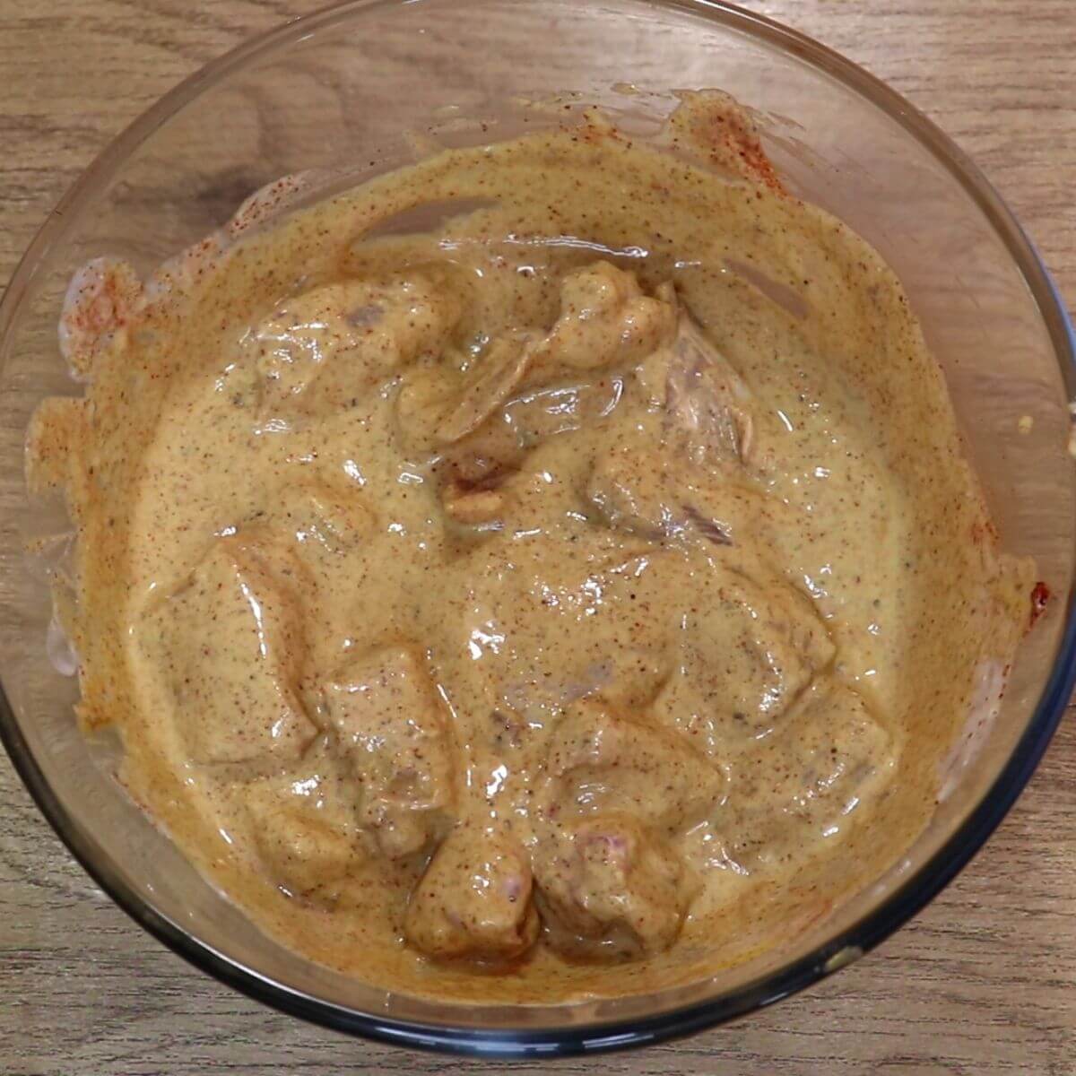 Chicken marinated with yogurt and spices for dahi chicken recipe.