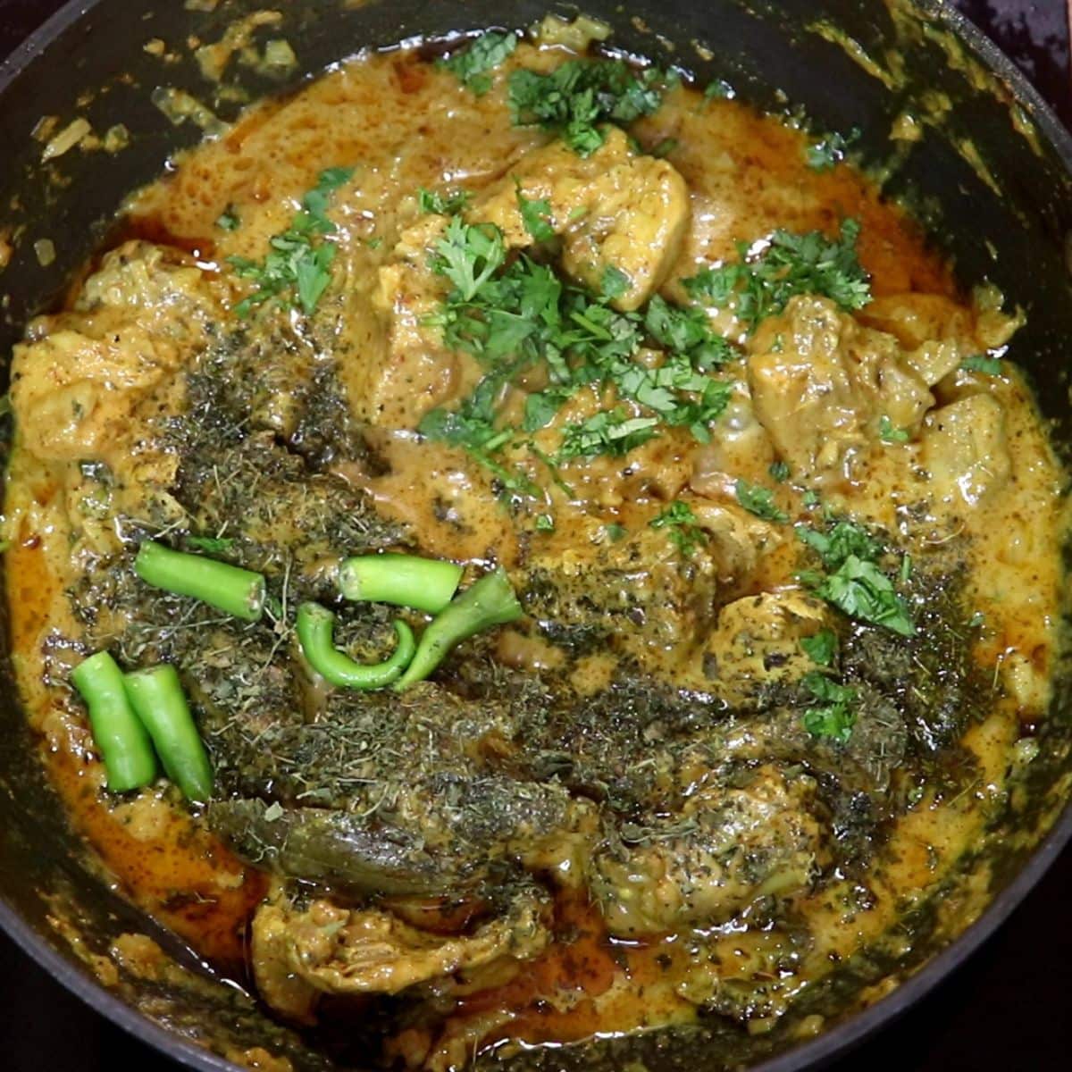 Green chilies and kasuri methi added to dahi chicken.