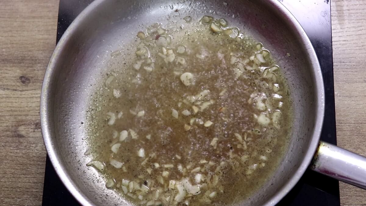 lemon garlic sauce simmering in a pan.