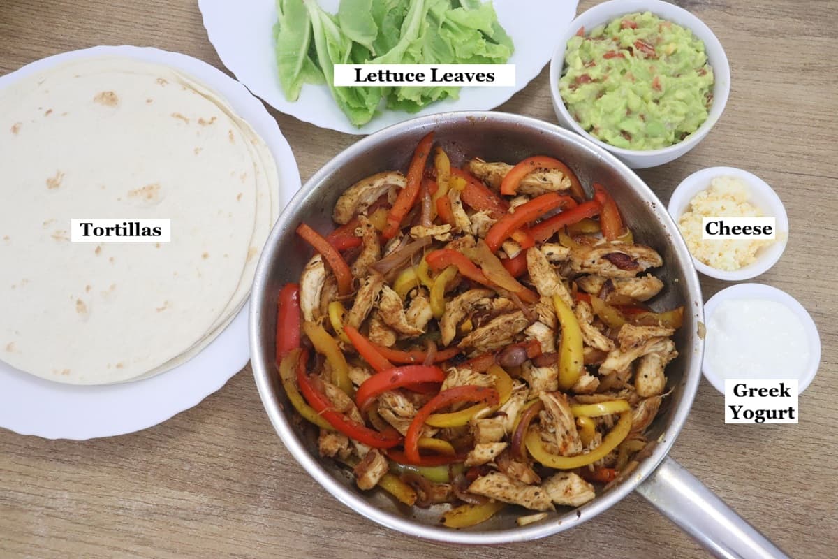 individually labelled ingredients to assemble chicken fajita wrap.