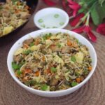 Restaurant-style chicken fried rice served in a bowl.