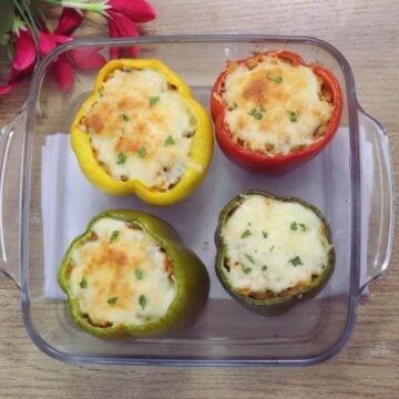 Mediterranean stuffed peppers in a baking tray.
