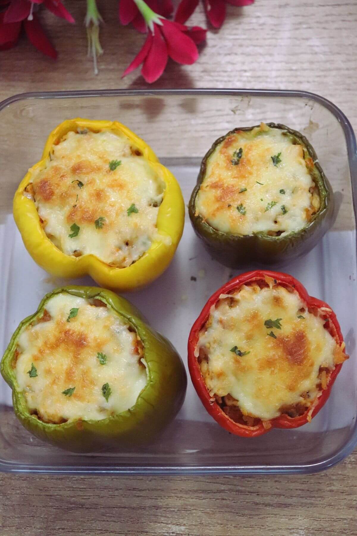 Mediterranean stuffed peppers filled with rice, chicken, and feta.
