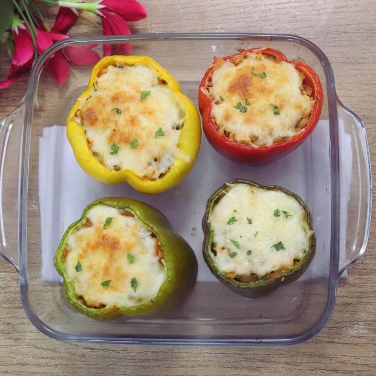Mediterranean stuffed peppers in a baking tray.