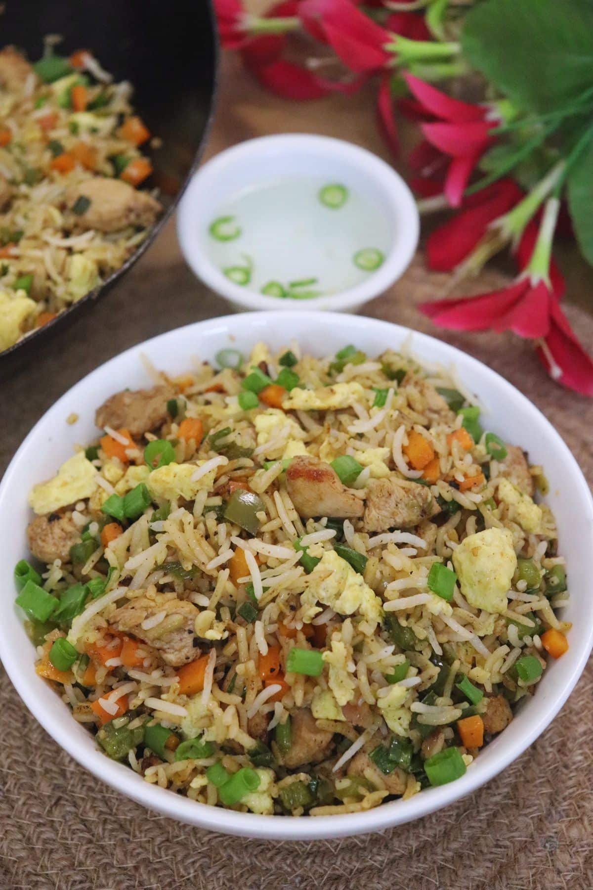 Restaurant-style chicken fried rice with vegetables and eggs.